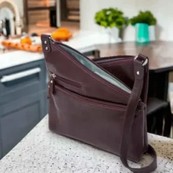 VAANYA Cowhide Leather Zipped Crossbody Bag(RAISIN)